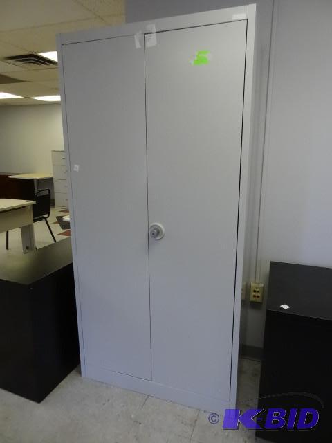 Metal 2 door cabinet. 4 shelves. 38...
