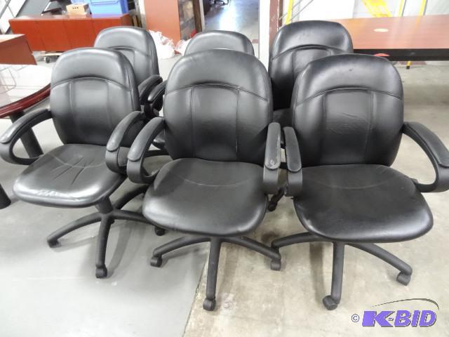 6 matching office chairs on wheels...