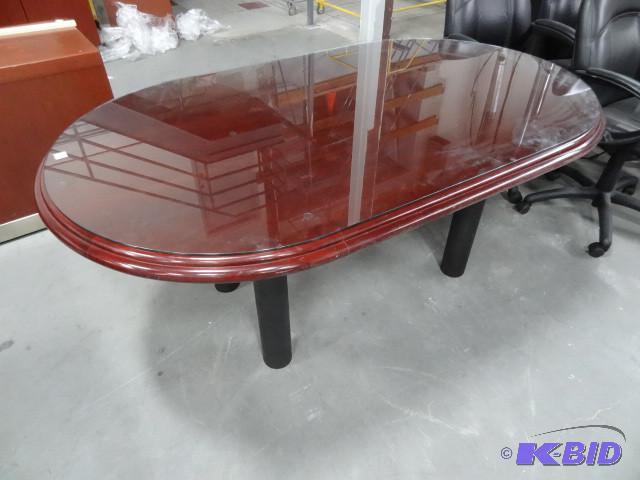 Glass top table with cherry finish....