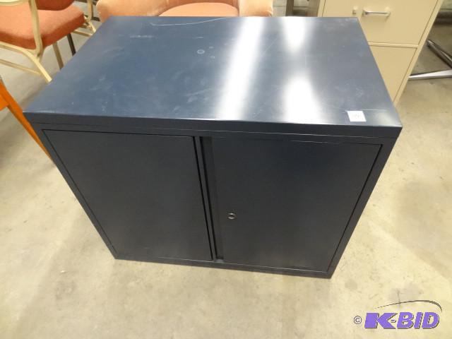 2 door metal cabinet. 36 x 20 x 26...