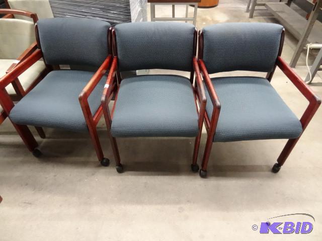3 matching wood framed chairs on wh...