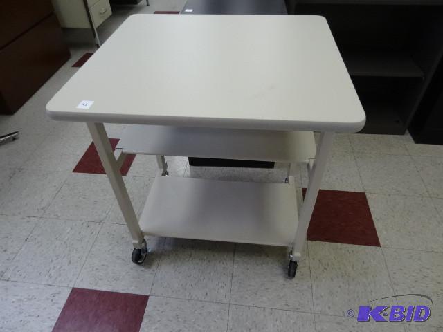 Table on wheels. 27 x 25 x 31...