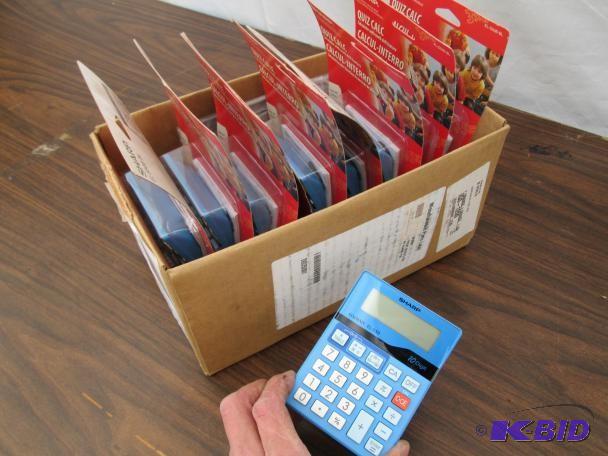 lot 28 image: New Sharp EL-S50 calculators. Some ...