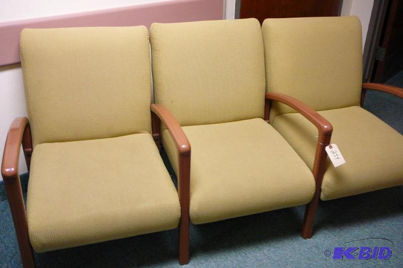 Green waiting room chairs 3 side by...