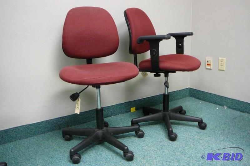 2 adjustable red office chairs with...