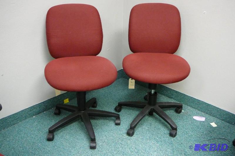 2 adjustable red office chairs with...