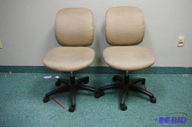 2 adjustable brown office chairs wi...