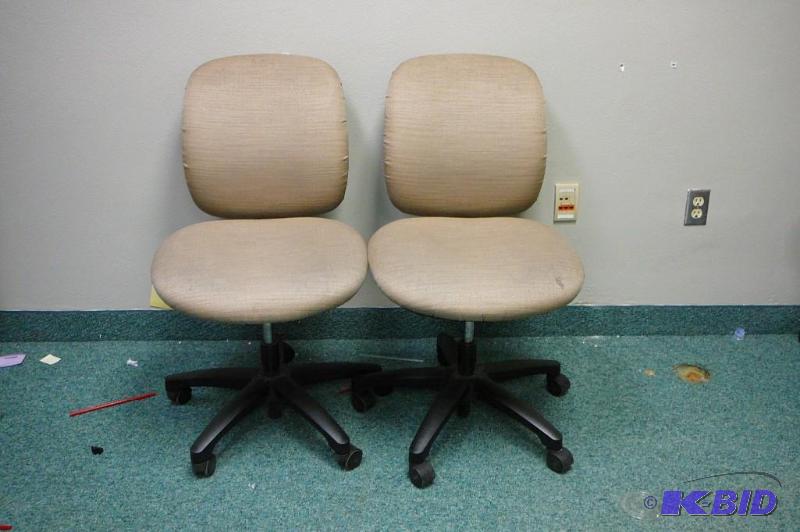 2 adjustable brown office chairs wi...