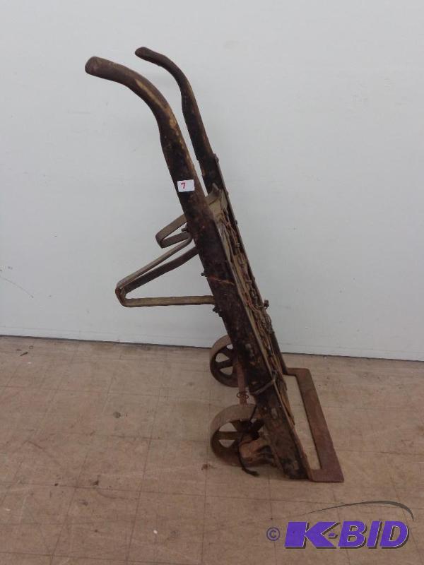 lot 11 image: Antique Steel Wheeled Dolly 5 Tall...