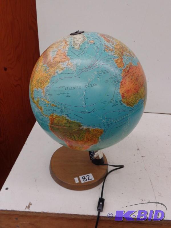 lot 82 image: World Globe with Stand Plugged in a...