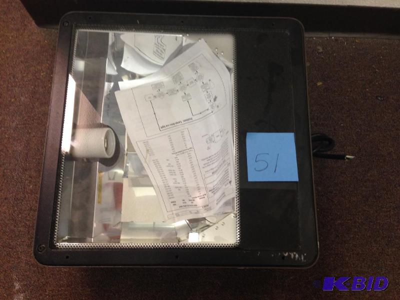 Projector with paperwork.&nbsp Thi...