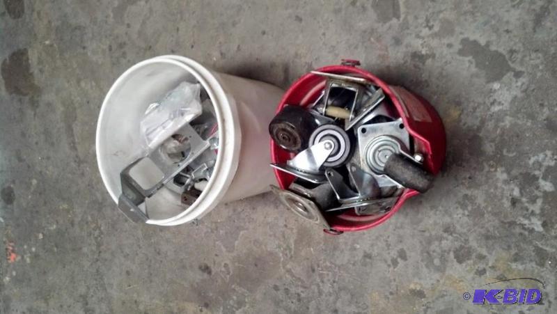 White bucked of assorted metal clamps, 19 wheels casters