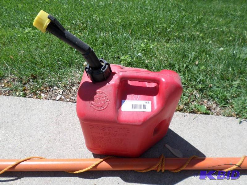 lot 134 image: gas can and pole pruner...