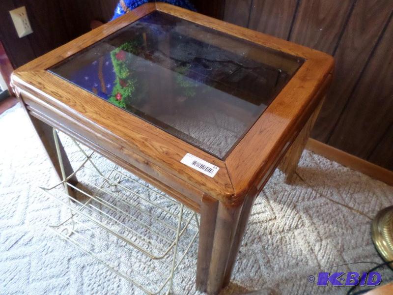 lot 23 image: Glass top coffee table and Magazine...