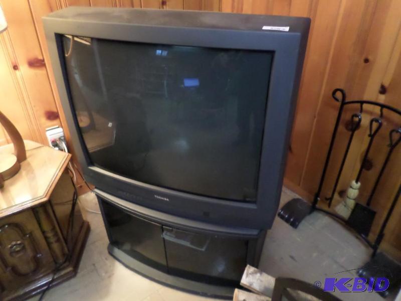 lot 73 image: Toshiba TV, Stand and VCR with remo...