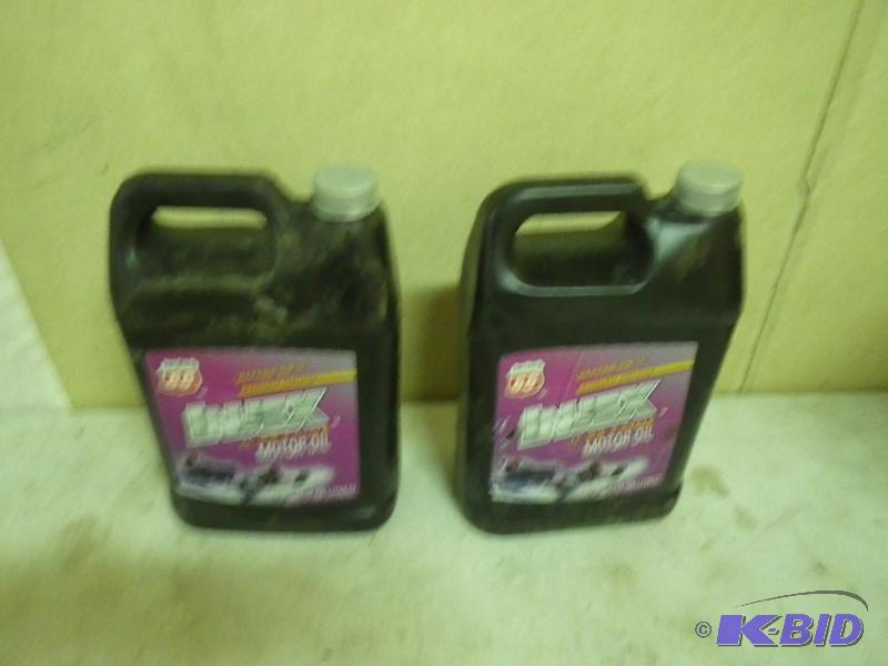 lot 101 image: 2 gallons of new Injex 2 cycle oil...