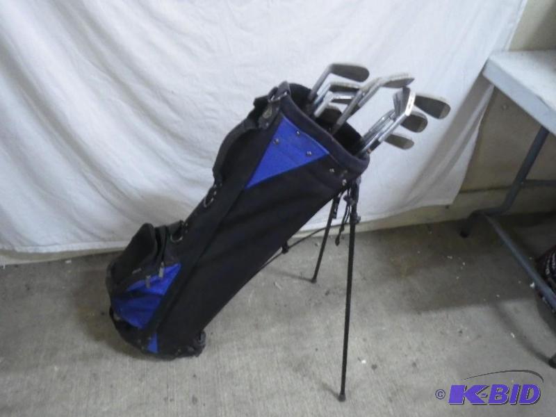 lot 105 image: golf bags and clubs...
