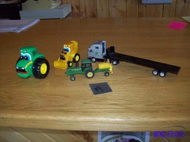 Assortment of John Deere toys -(4) ...
