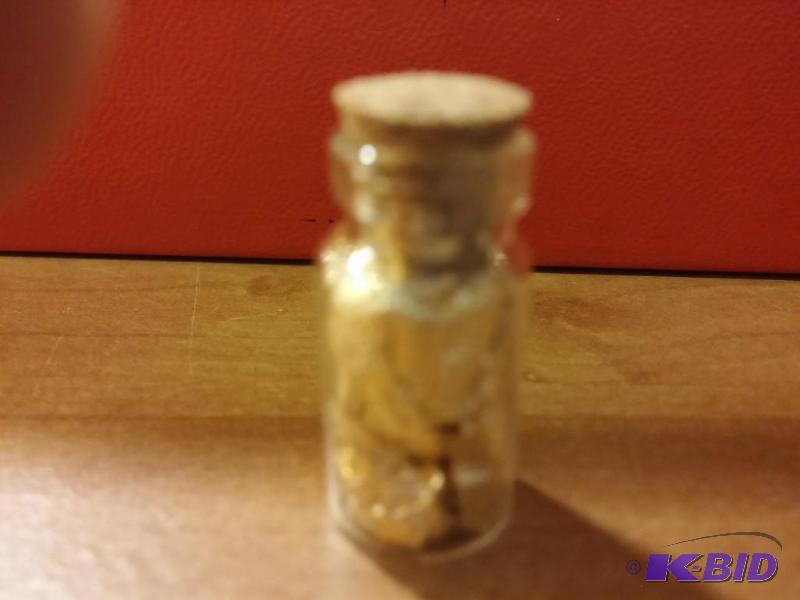 1 VIAL OF GOLD FLAKES...