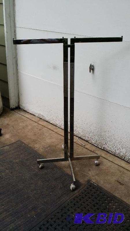 Clothes rack on caster wheels with ...