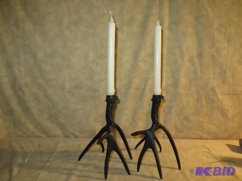 Black antler candle holders have a ...