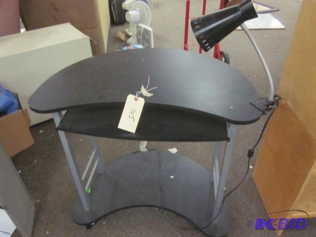 lot 145 image: Black computer desk with side lamp....