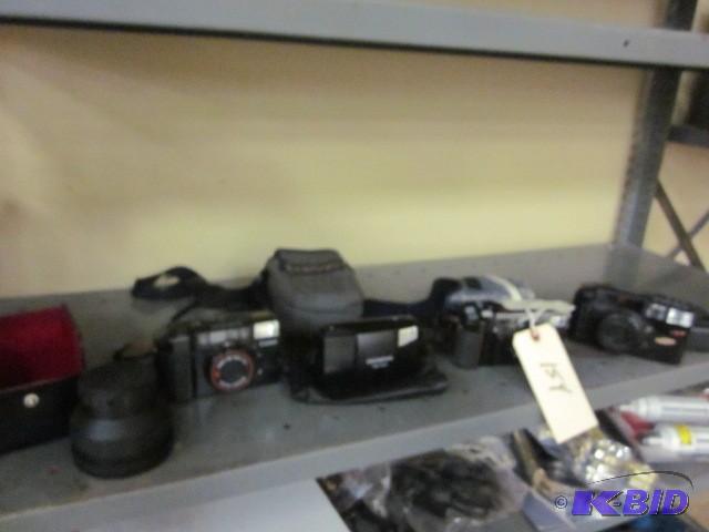 lot 154 image: All cameras and lenses, on shelf, a...