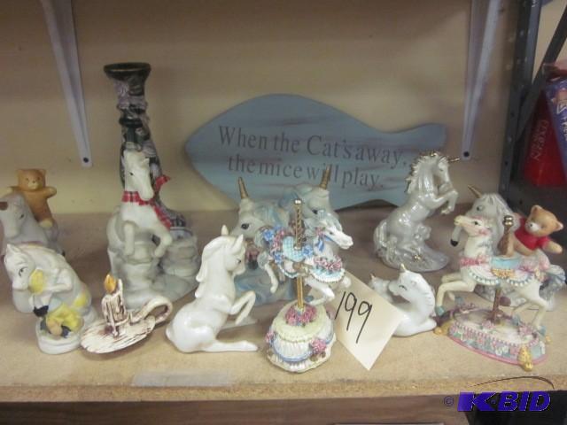 lot 199 image: Lot of unicorns, candle stick, and ...