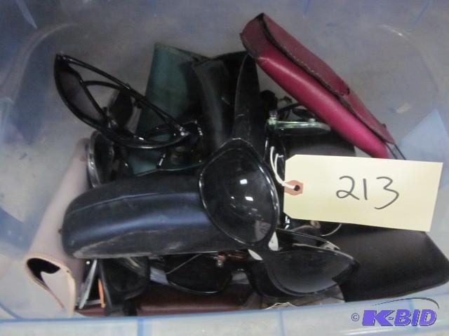 lot 213 image: Bin of sun glasses....