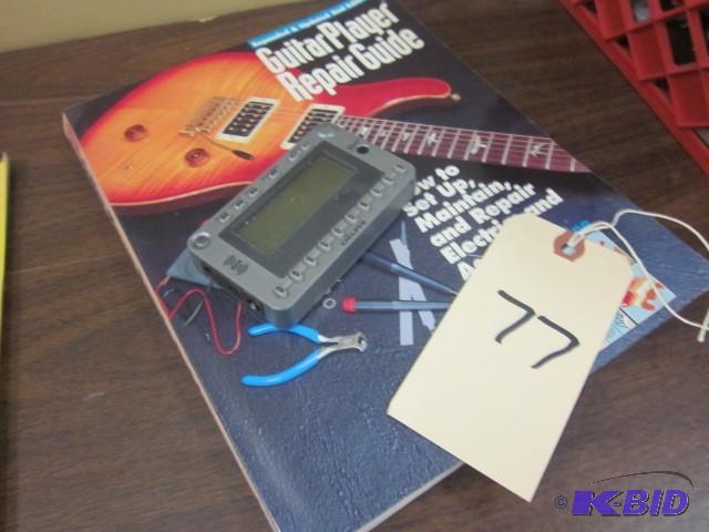lot 77 image: Guitar player repair guide and Delp...