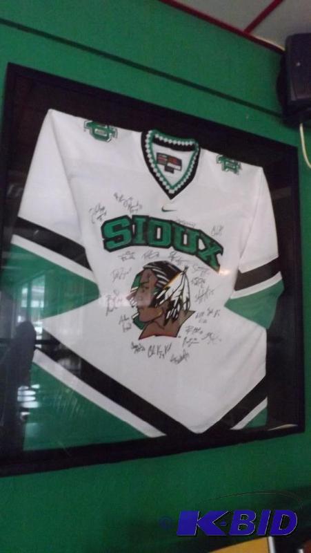 Sioux Hockey Jersey, signed and fra...