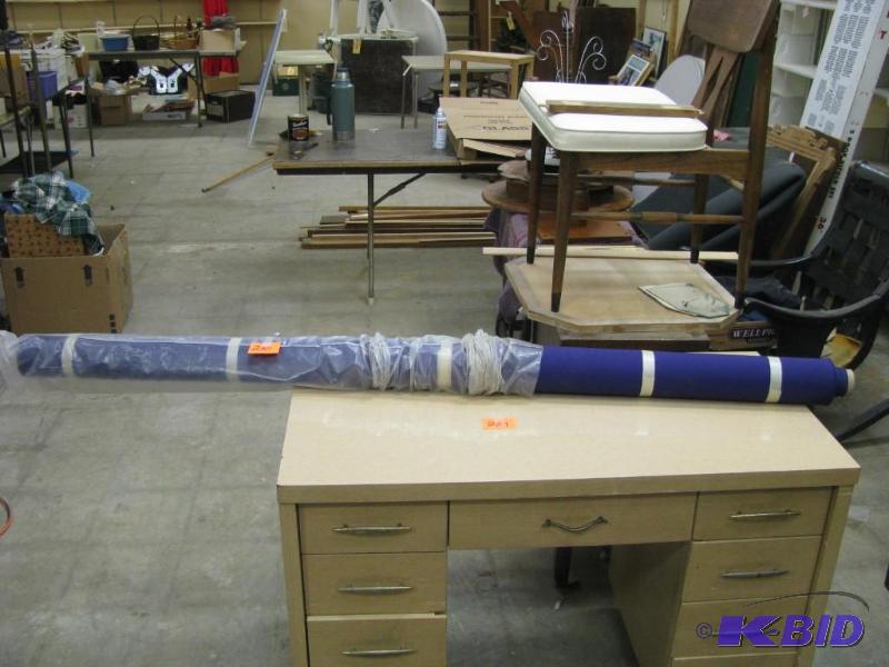 large roll of purple fabric, new on...
