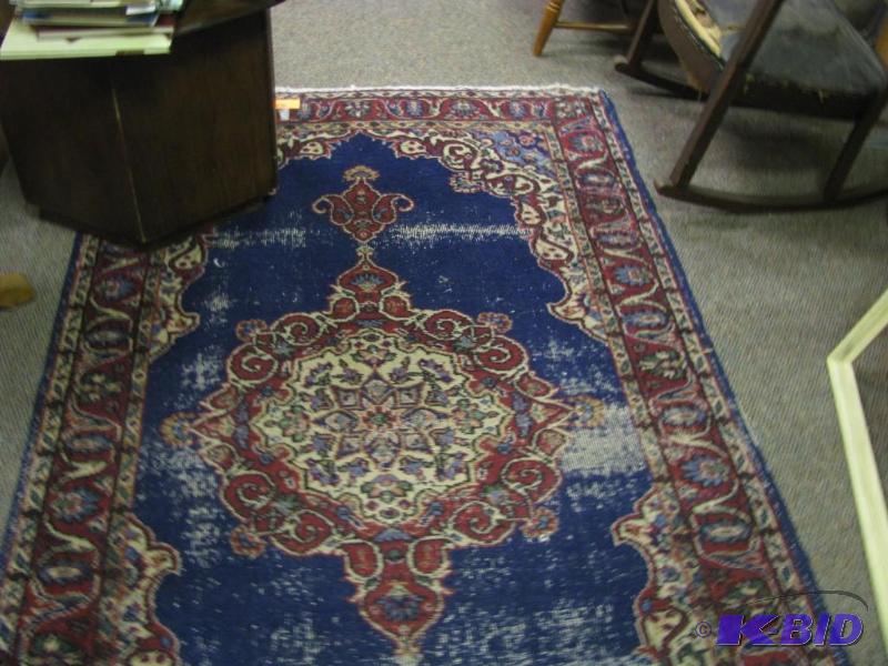 blue and red area rug worn but not ...