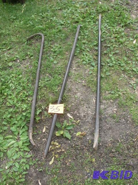lot 35 image: 3 long crow bars and prys.. Very he...