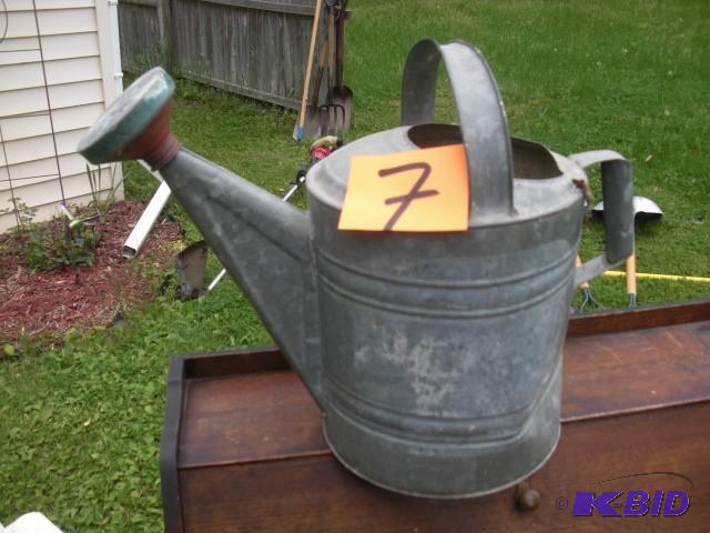 lot 7 image: Galvanized Watering pitcher...