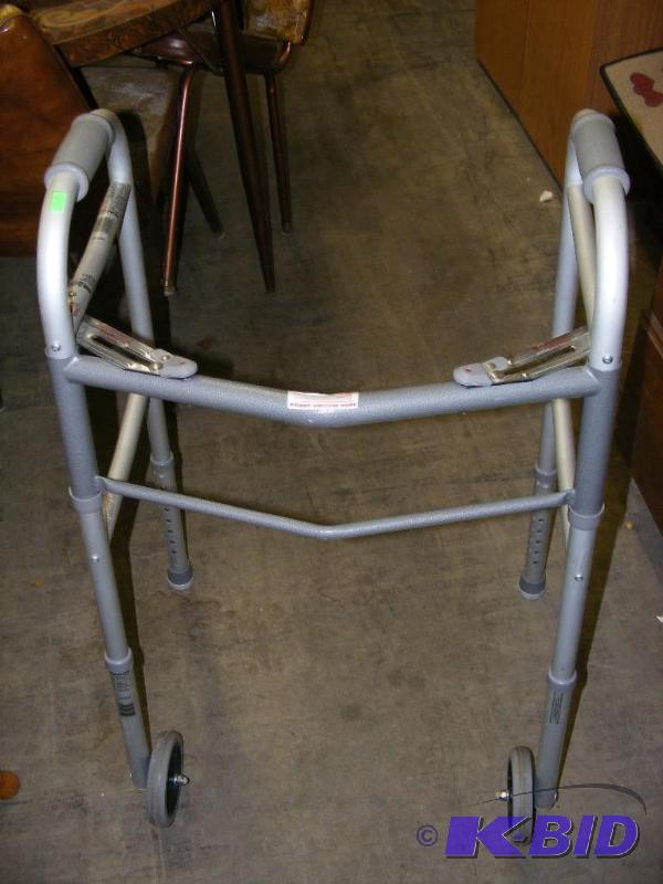 lot 135 image: Walker, has leg attachments to repl...