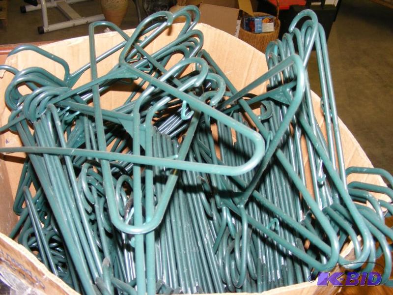 lot 136 image: Large Box of Green Plastic Hangers...