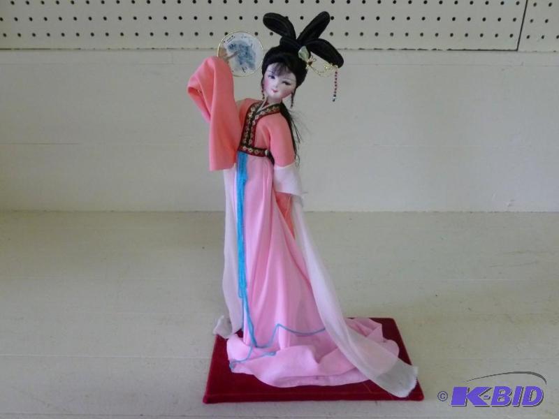 lot 132 image: Beautiful oriental doll that measur...