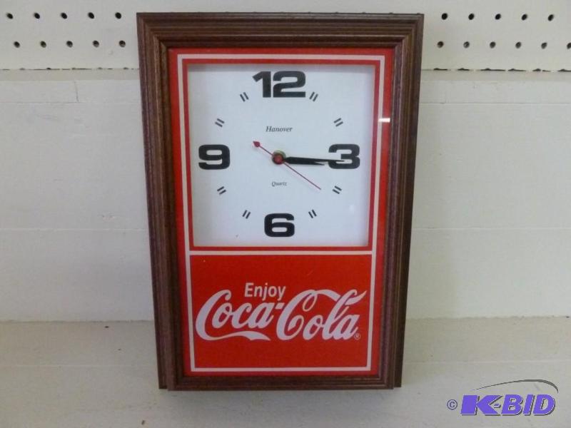 lot 163 image: Enjoy Coca-Cola wood framed wall cl...