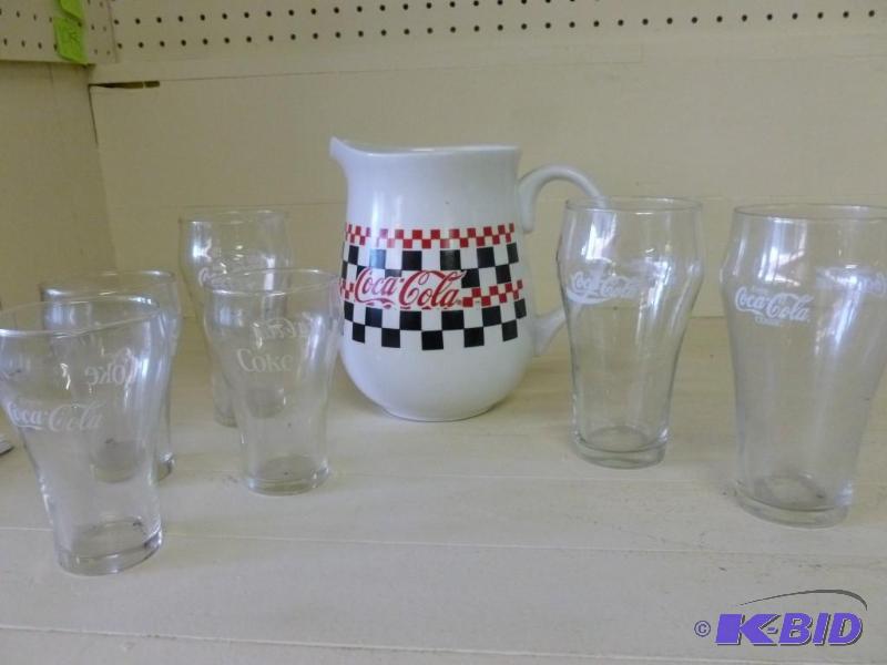 lot 197 image: Coca-Cola drink set that includes a...