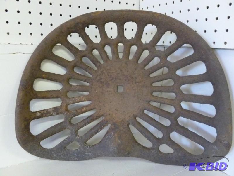 lot 8 image: Antique Deering cast iron implement...