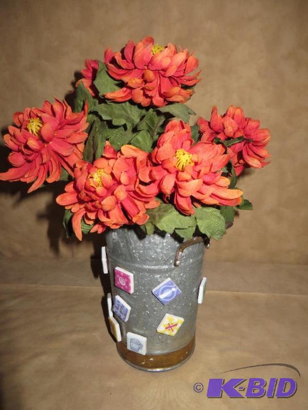 Tin bucket with flowers and a lot o...