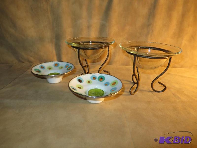 Two pairs of candle holders both in...