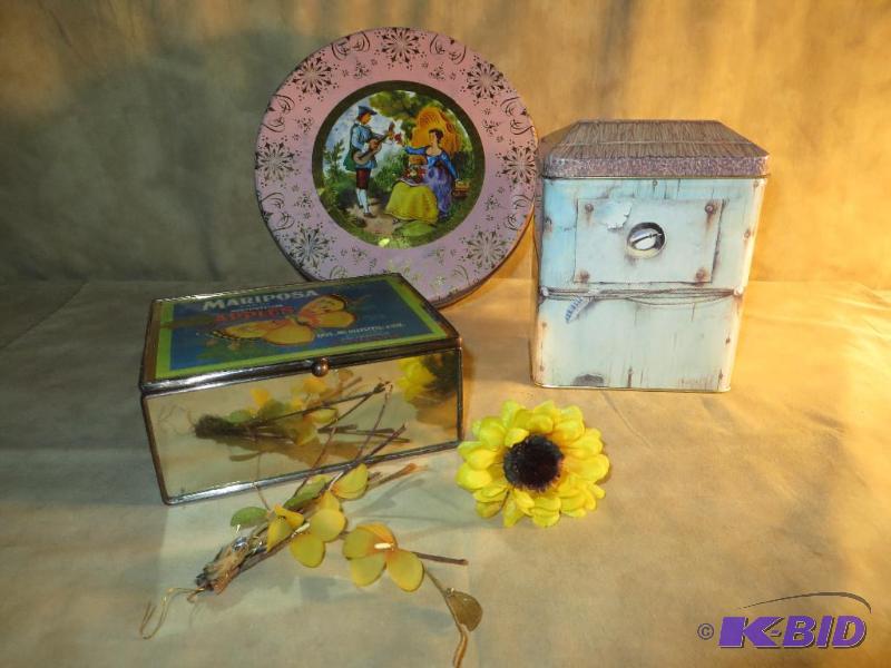 Two tins and a mirrored box with so...
