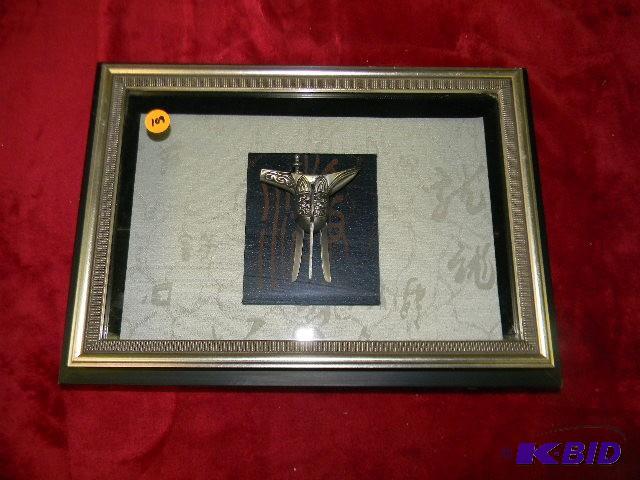 Pewter statue in glass frame...