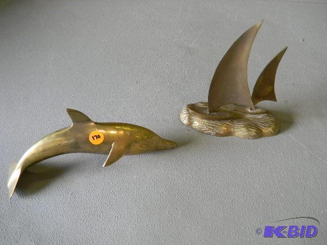 Brass dolphin and boat figurines...