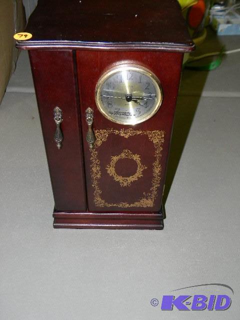 Wooden jewelry box with clock on ou...
