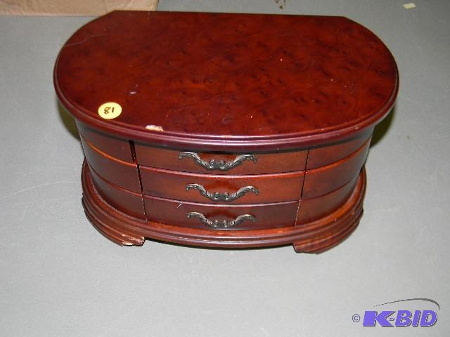 Wooden jewelry box with lots of com...