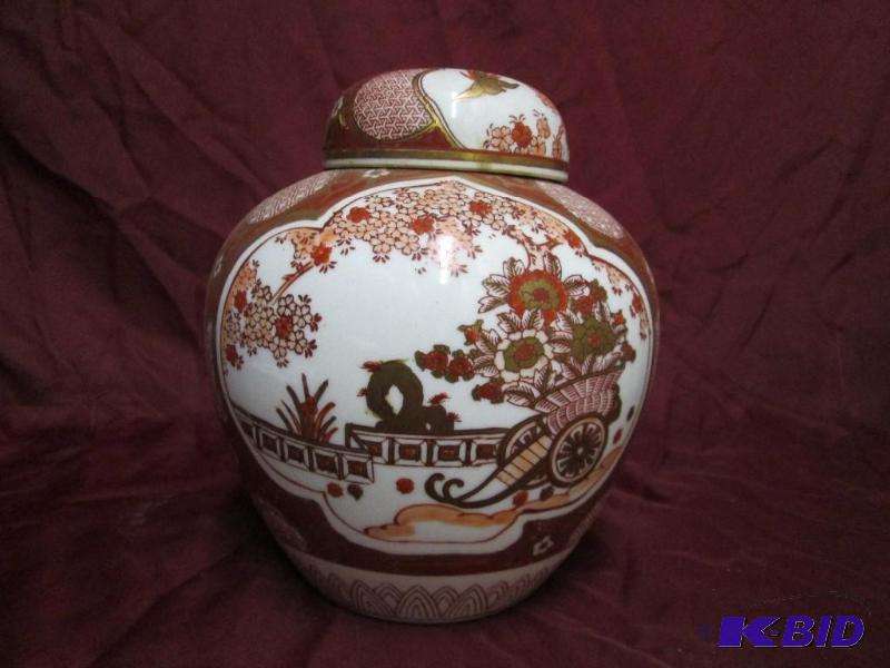 Oriental red and white vase with go...