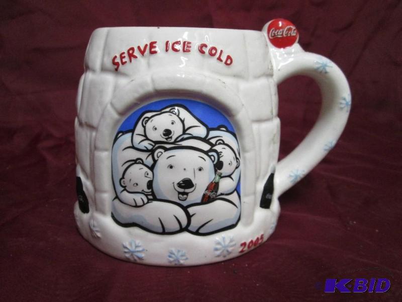 lot 17 image: 2005 Coca-Cola mug shaped like an i...
